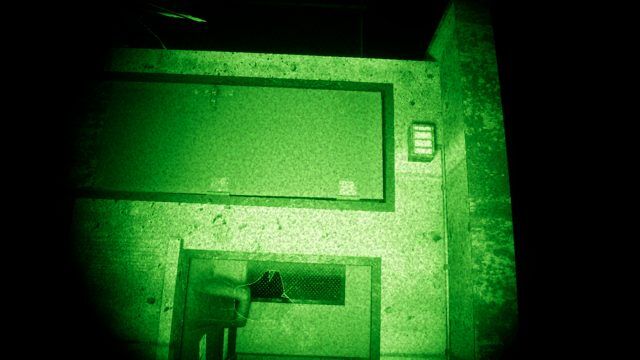 Through the wrist device’s night vision: inside the guard post.